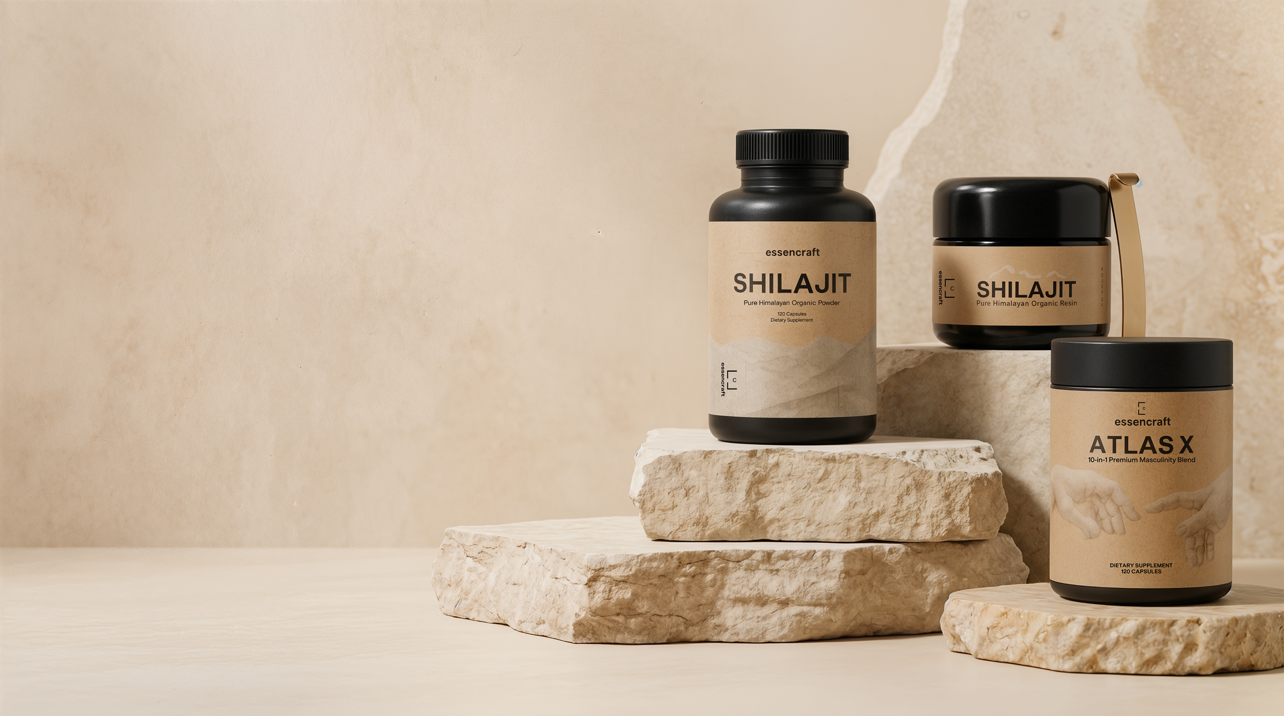 Essencraft Shilajit Resin, Shilajit Capsules and Atlas X arranged on warm stone plinths.