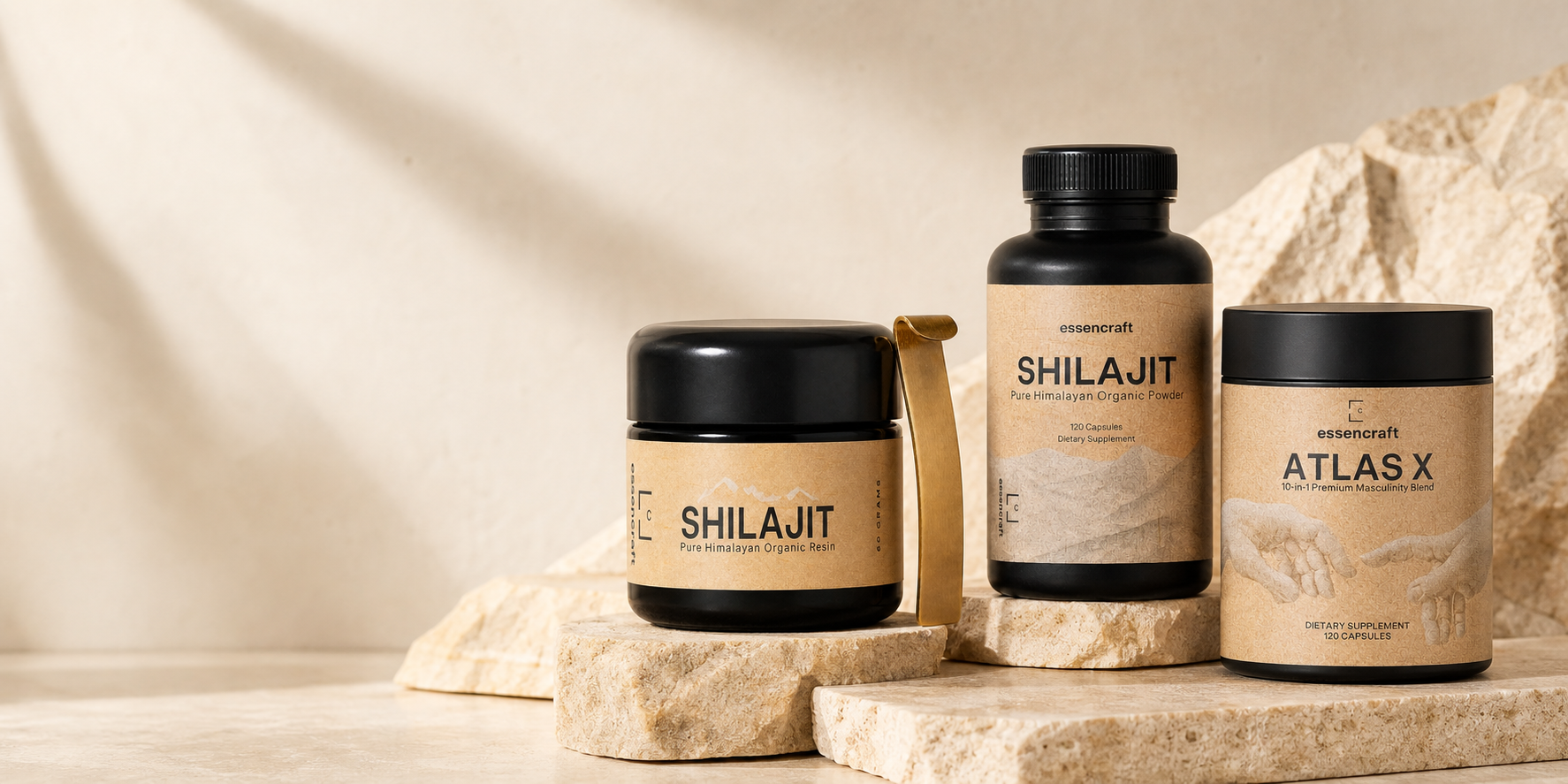 Essencraft Shilajit Resin, Shilajit Capsules and Atlas X arranged on warm stone plinths.