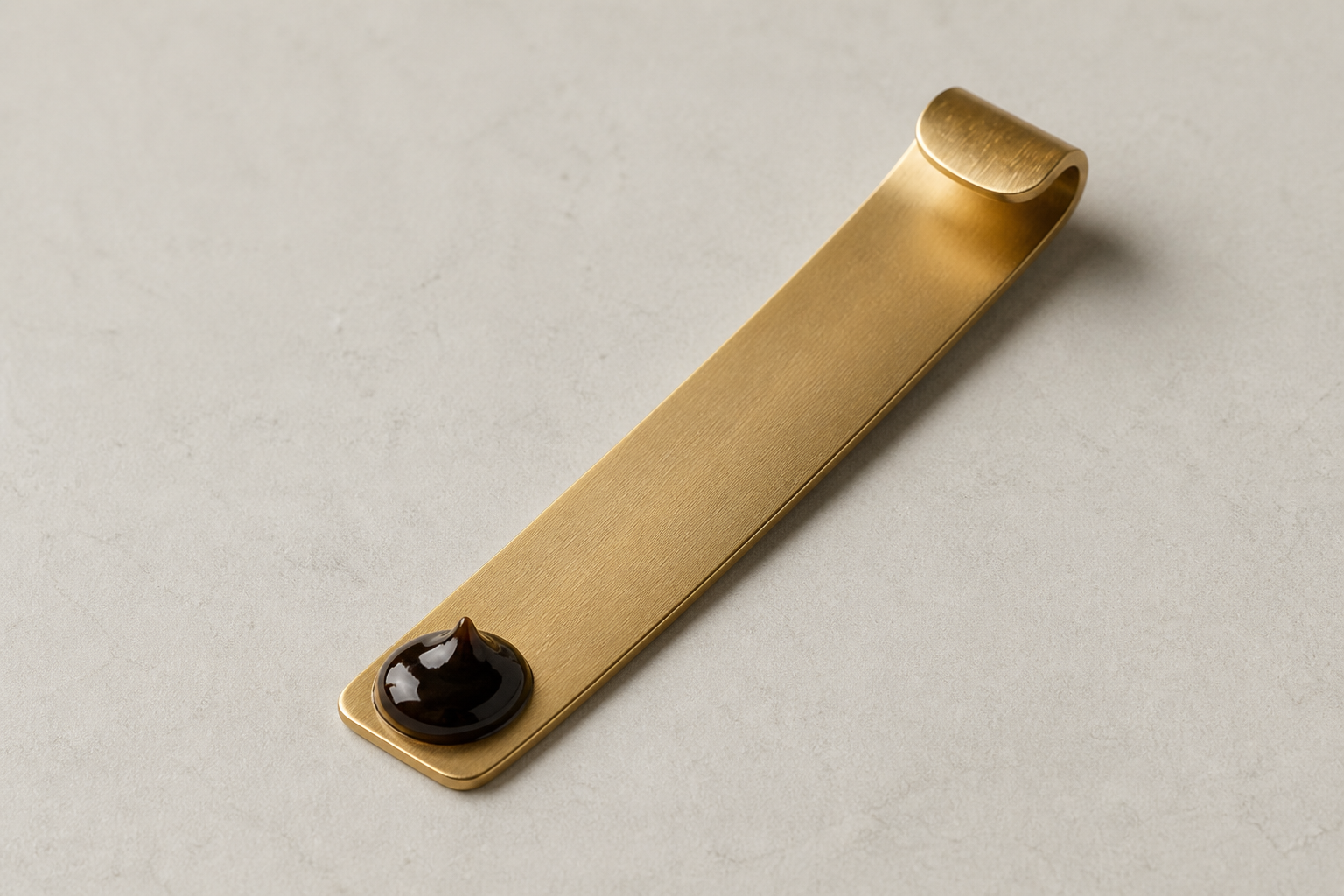 Bronze hanging spoon with a labelled serving of Shilajit Resin